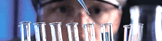 Researcher and Test Tubes